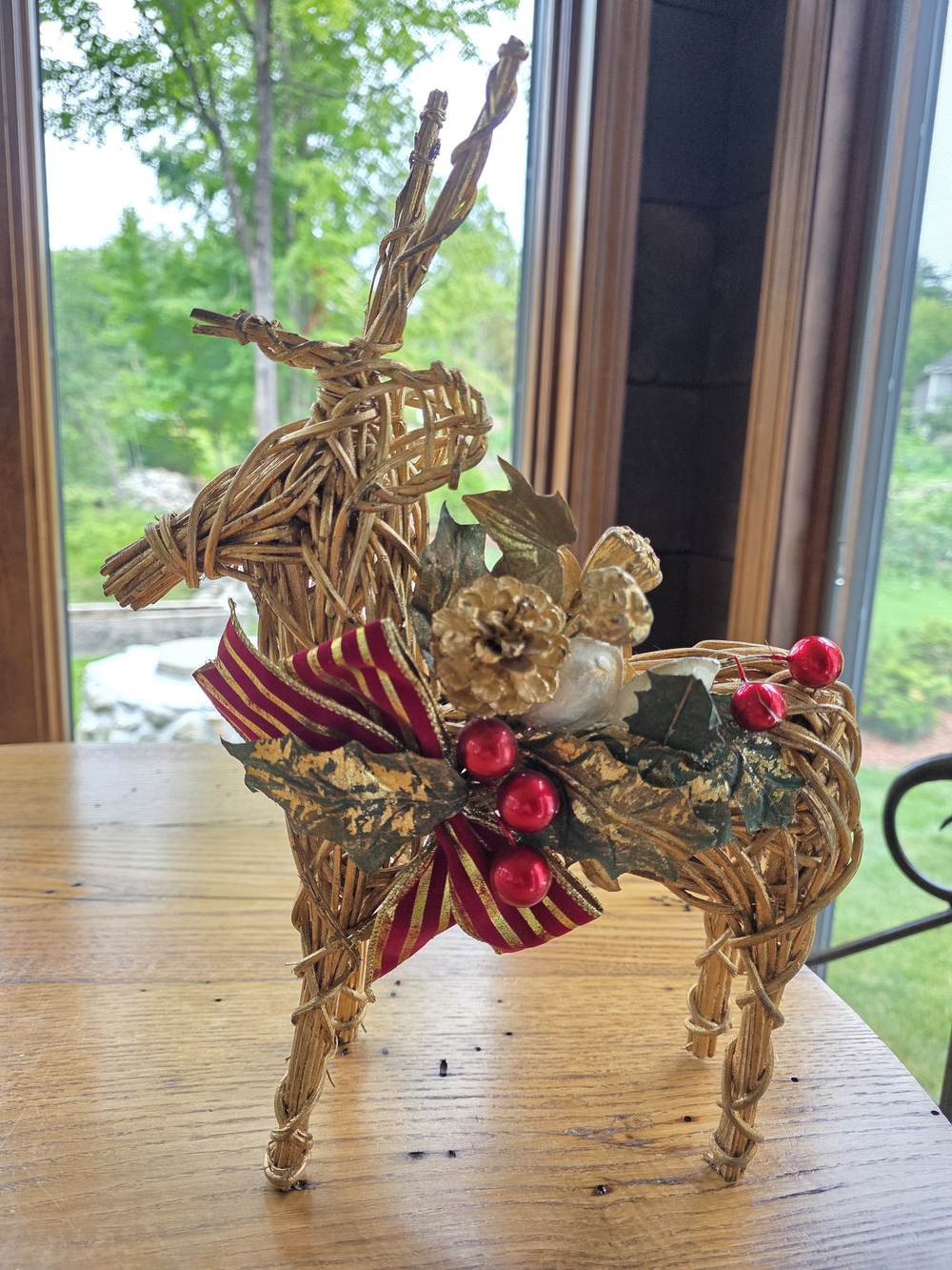 Woven Rattan Reindeer Holiday Décor with Gold Accents and Red Berries